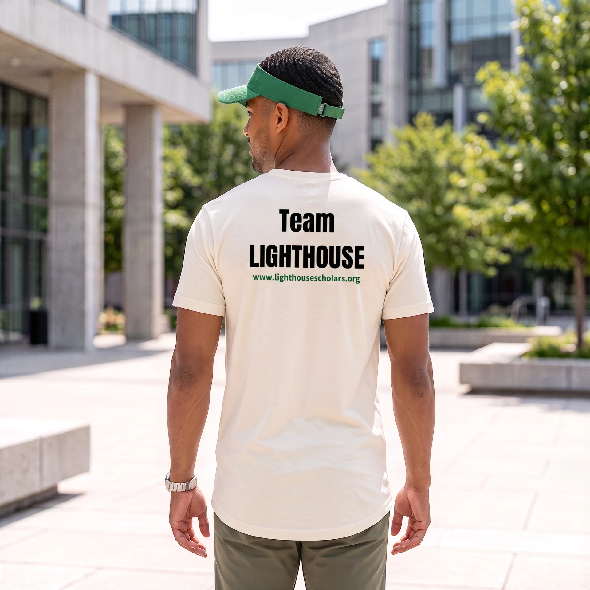 Volunteer wearing the Team Lighthouse T-shirt and green visor